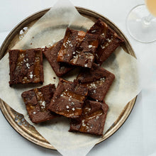 Exploding Bakery Salted Caramel Letterbox brownie cut up into portions.